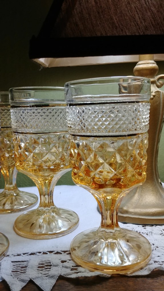 close-up of amber ombre flash Wexford wine goblets.