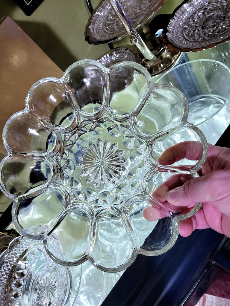 an Anchor Hocking Fairfield deviled egg plate, since Wexford never produced one I was looking for an option that shared some design features. the scalloped edge created by the egg cups, and the center daisy certain meet that need.