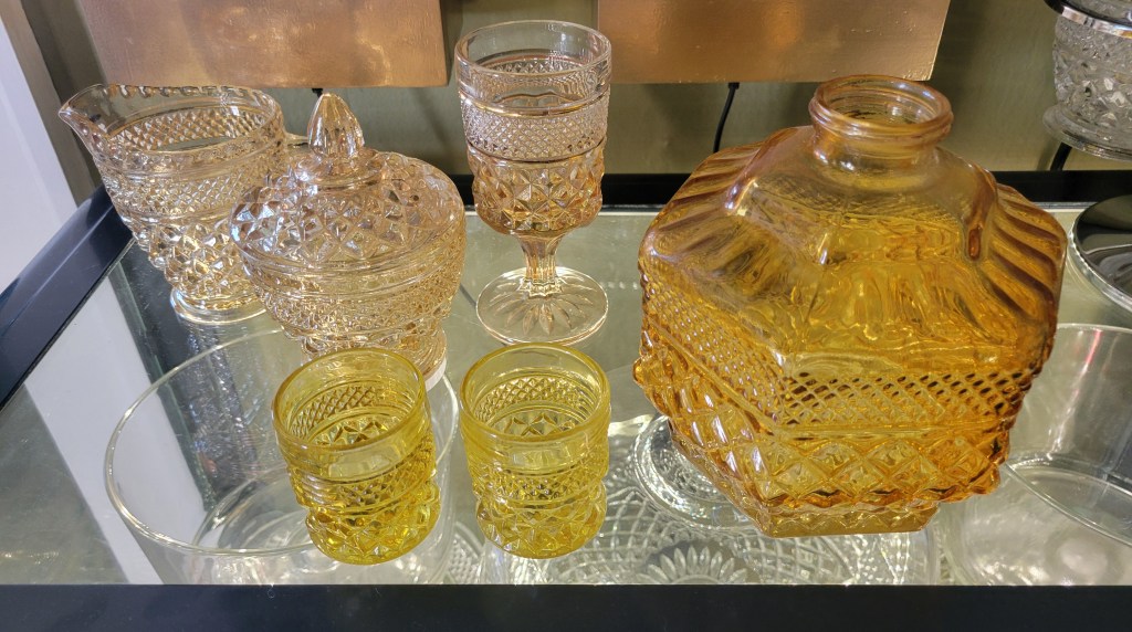 a few amber and amber ombre pieces with the brighter yellow amber votives and the deeper amber oil lamp base
