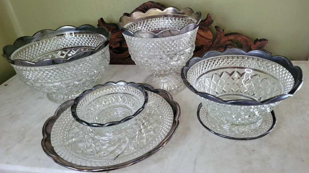 an assortment of Wexford silver-trimmed scalloped edge pieces