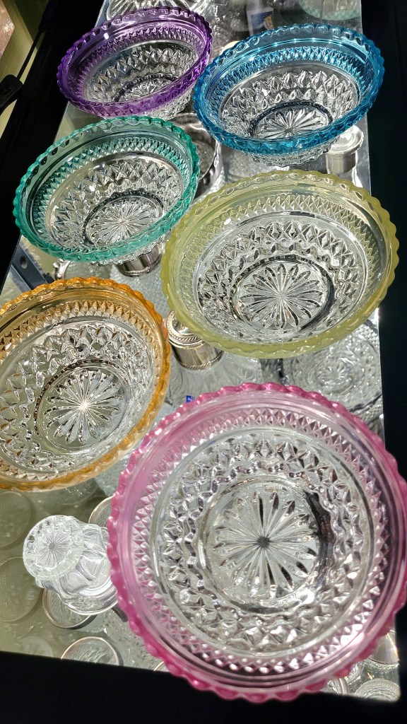 a set of Pasari knockoff berry bowls with various collor flash trim