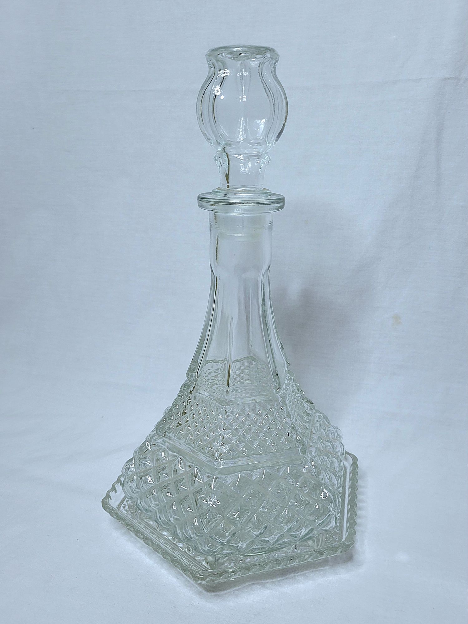 a grouping of Wexford vintage glassware by Anchor Hocking: a hexagonal plate with a captain's decanter. 