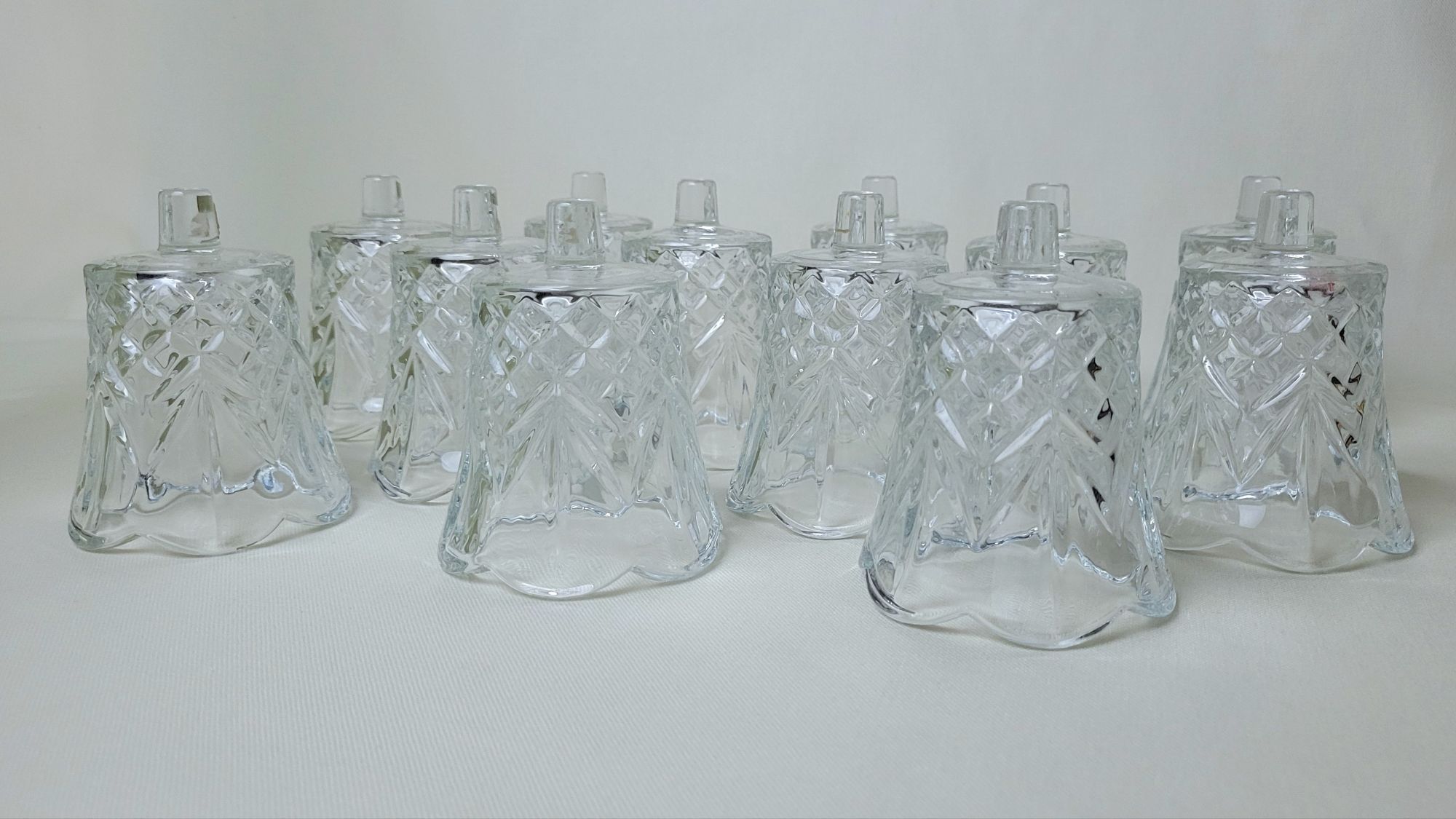 a photo of twelve upside-down vintage Cambridge peg votives by HOMCO